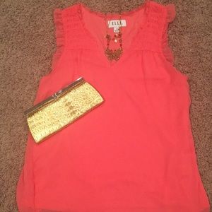 Sleeveless shirt, necklace and gold clutch!